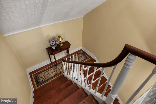 stairs with wood-type flooring