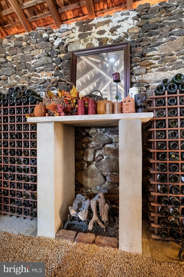 wine cellar with vaulted ceiling with beams and wooden ceiling