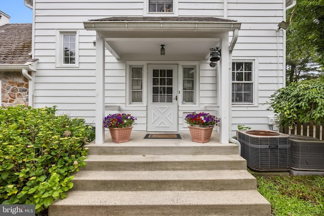 view of exterior entry featuring cooling unit