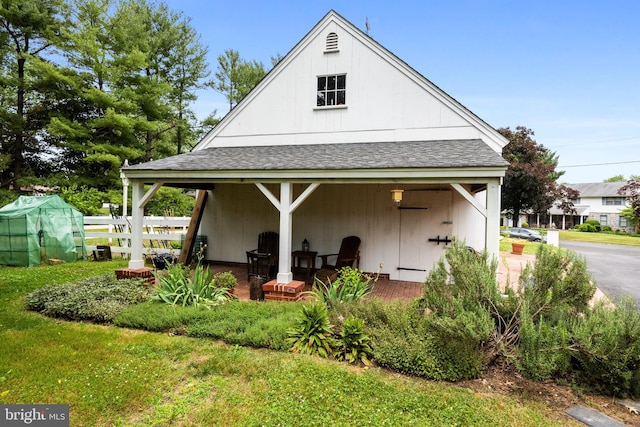 rear view of house featuring a porch