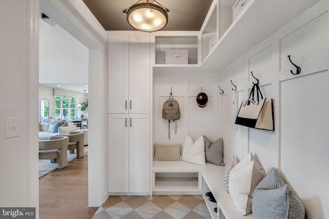 mudroom with light hardwood / wood-style flooring