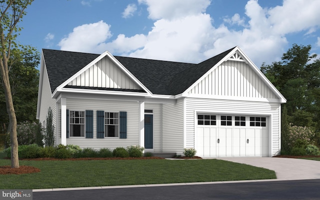 view of front of home with a front yard and a garage