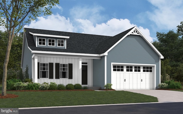 view of front of home with a garage and a front lawn