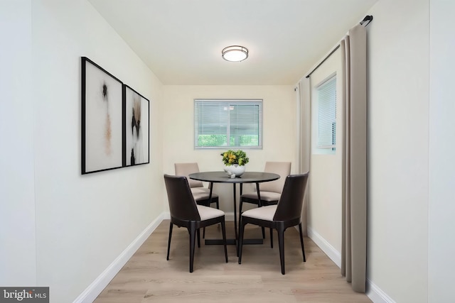 dining space featuring light hardwood / wood-style floors