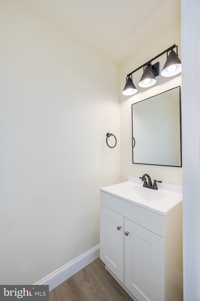 bathroom with vanity and wood-type flooring