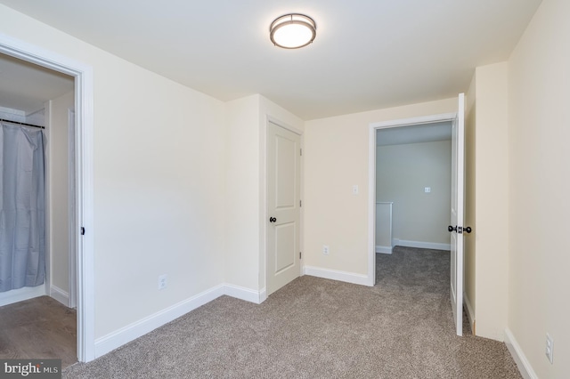 unfurnished bedroom with light colored carpet