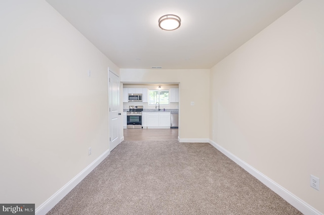 interior space with carpet floors and sink