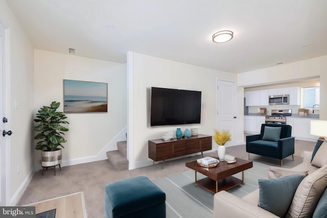 living room featuring light colored carpet