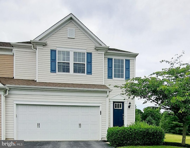 view of front of property featuring driveway and a garage