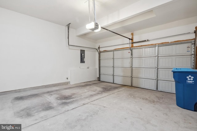 garage with electric panel, baseboards, and a garage door opener