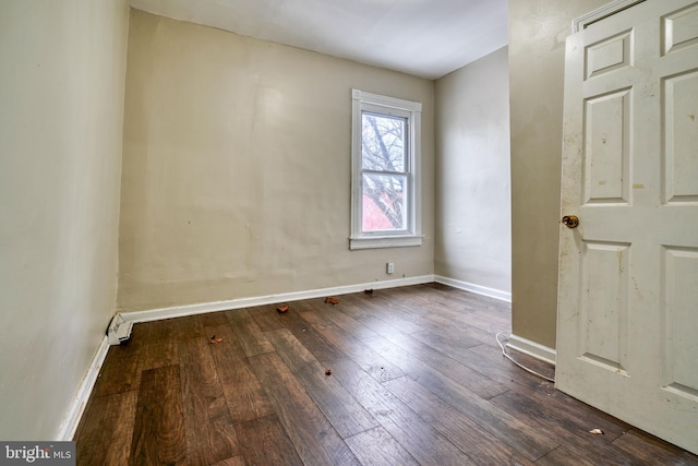 spare room featuring dark hardwood / wood-style floors