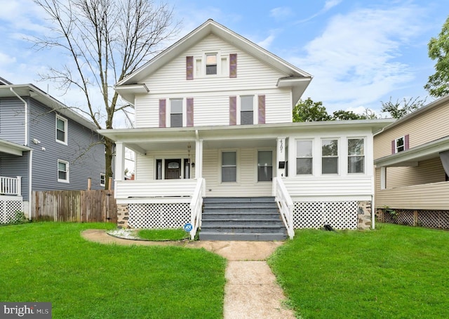 view of front property with a porch and a front yard