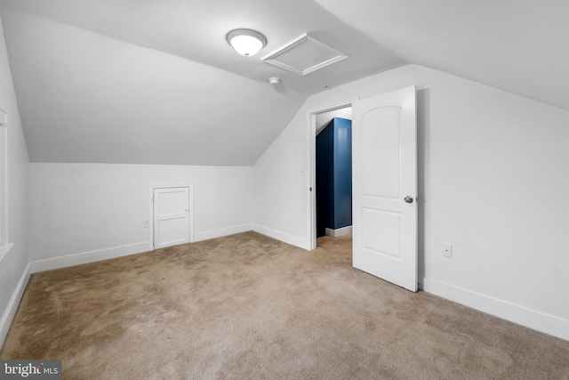 bonus room featuring light colored carpet and lofted ceiling