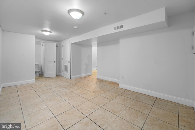 basement with light tile patterned floors