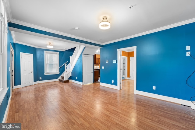 unfurnished room with hardwood / wood-style floors and crown molding