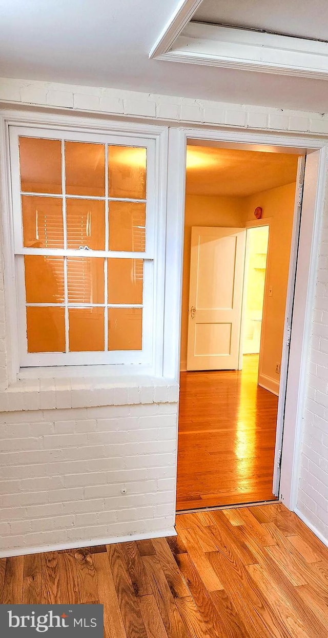 corridor featuring hardwood / wood-style flooring