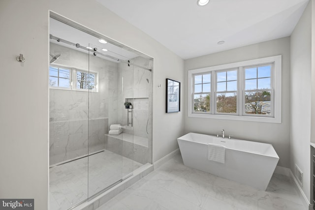 bathroom with shower with separate bathtub