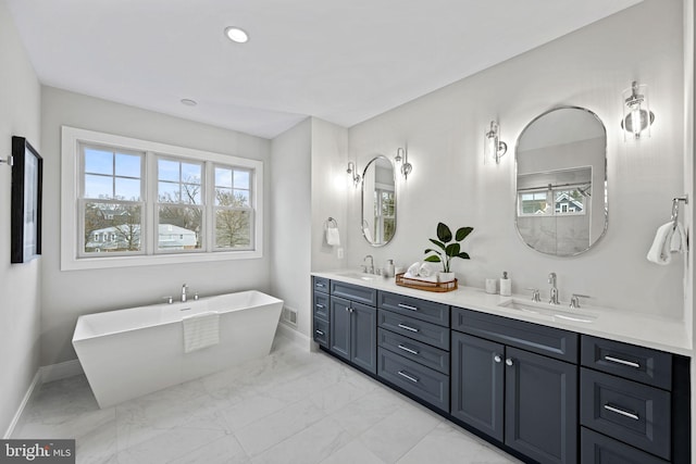 bathroom with a bathtub and vanity