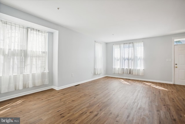 empty room featuring wood-type flooring