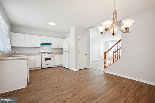 kitchen with light hardwood / wood-style flooring, white appliances, an inviting chandelier, decorative light fixtures, and white cabinetry