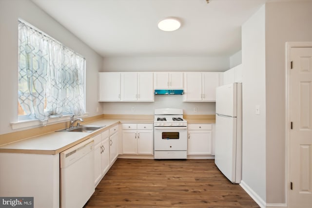 kitchen featuring dark wood-type flooring, white cabinets, sink, and white appliances