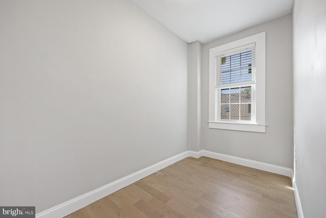 unfurnished room featuring light hardwood / wood-style floors