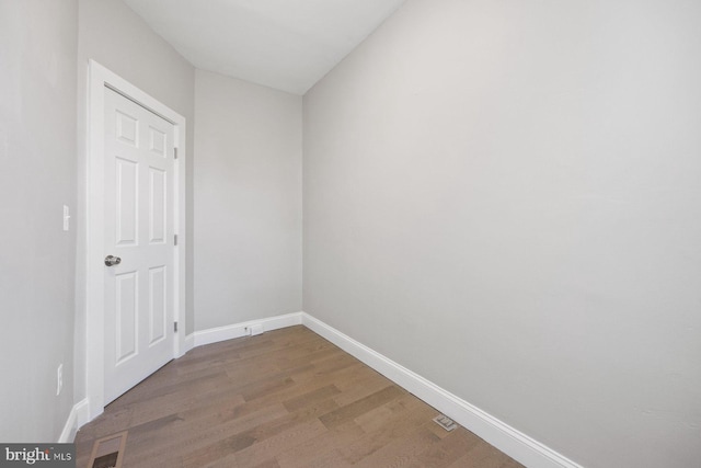 empty room with wood-type flooring