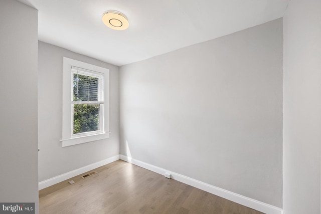 unfurnished room featuring wood-type flooring