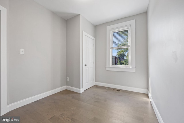 unfurnished room with light wood-type flooring