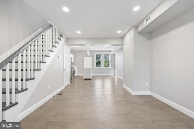 entrance foyer featuring wood-type flooring