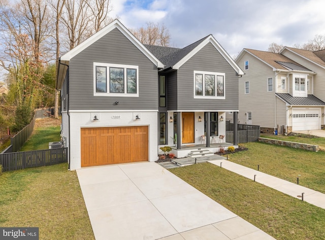 view of front facade featuring a garage and a front lawn