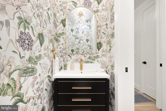 bathroom with vanity and hardwood / wood-style flooring