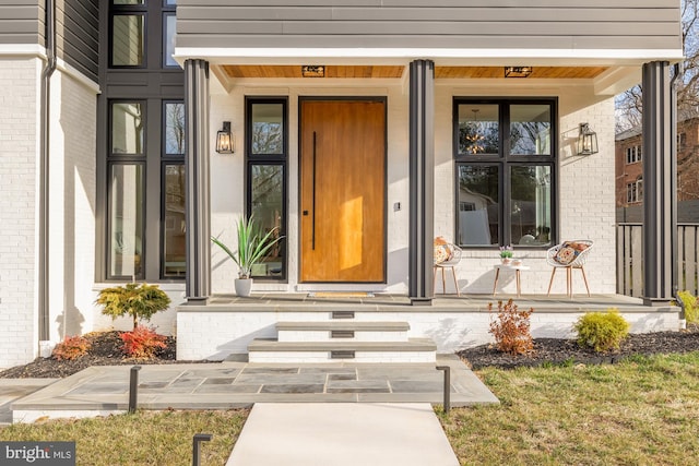 doorway to property with covered porch