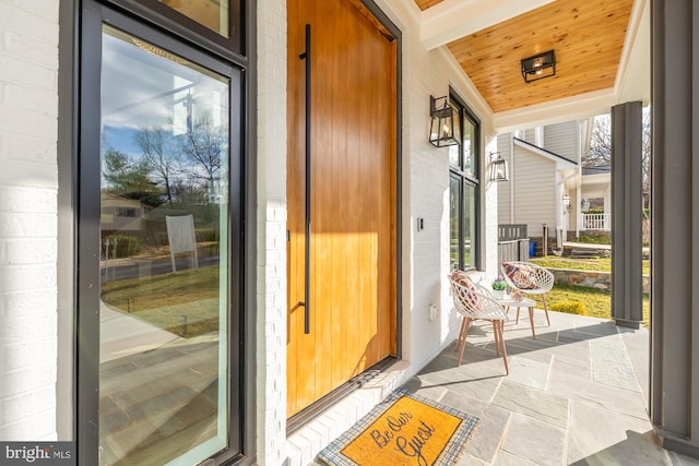 doorway with wooden ceiling