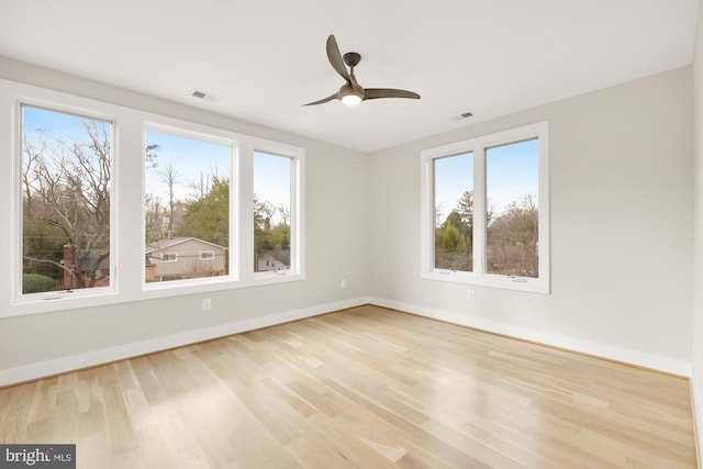 unfurnished room featuring ceiling fan and light hardwood / wood-style floors