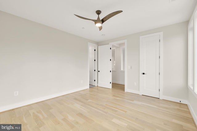 unfurnished bedroom with ceiling fan and light hardwood / wood-style floors