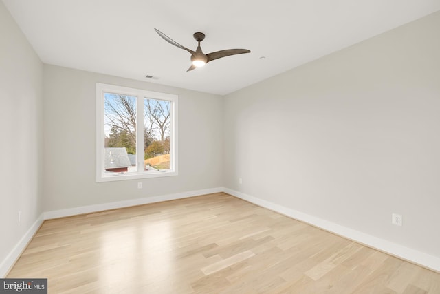 spare room with light hardwood / wood-style floors and ceiling fan