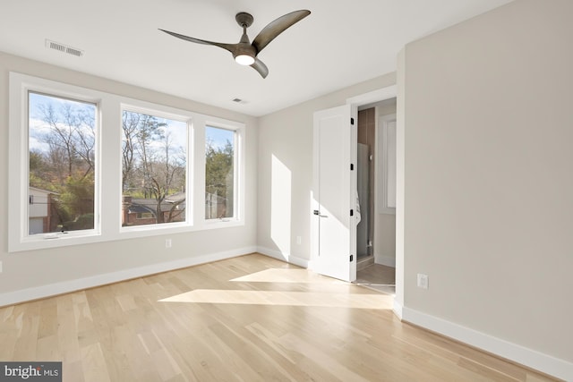 unfurnished room featuring ceiling fan and light hardwood / wood-style floors