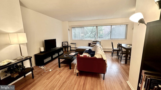 living room with light hardwood / wood-style flooring