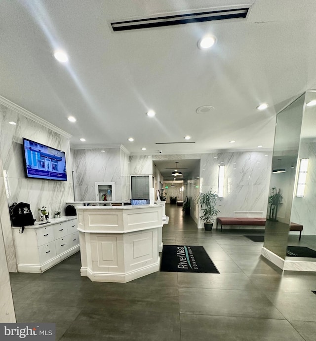 interior space with ceiling fan