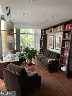 interior space featuring hardwood / wood-style floors and a wall of windows