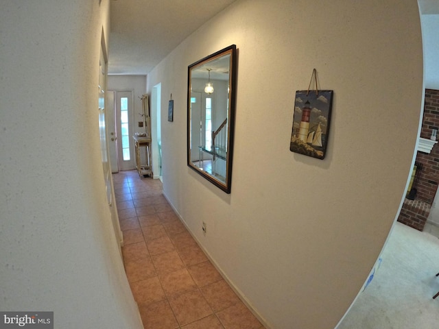 hallway with light tile patterned flooring