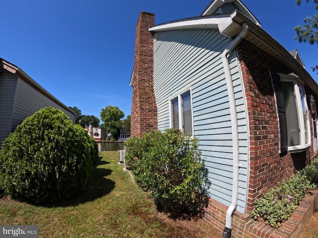 view of home's exterior featuring a lawn