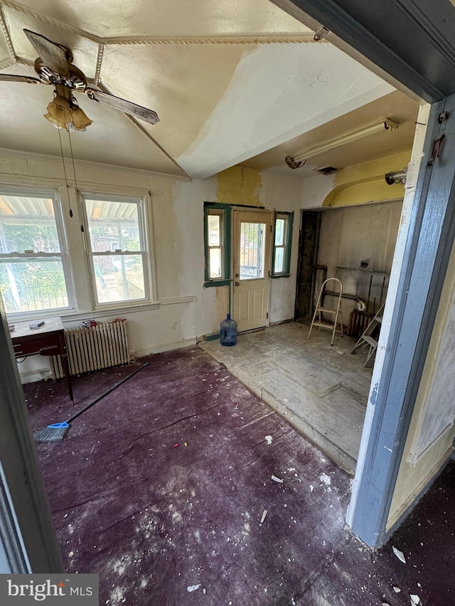 misc room with radiator and ceiling fan