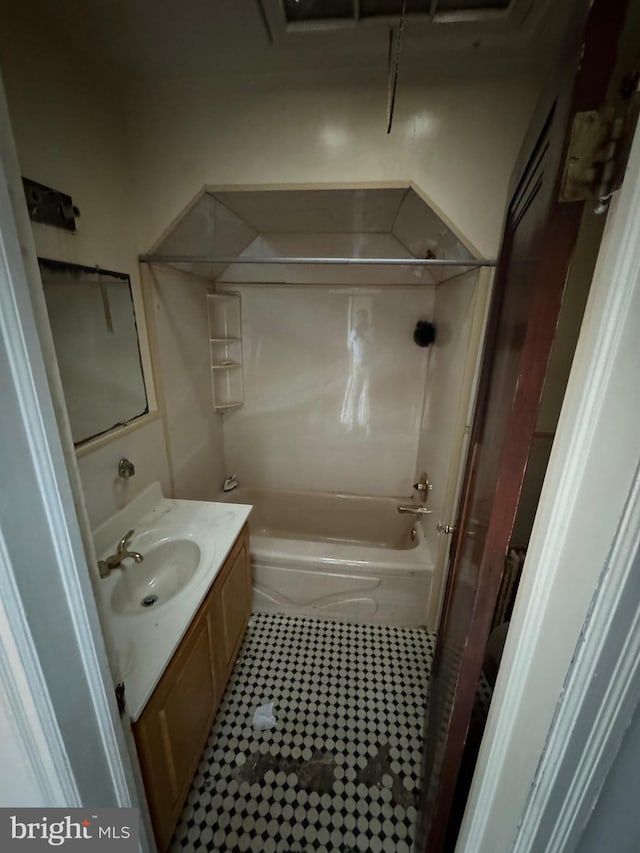 bathroom with vanity, tile patterned floors, and shower / washtub combination