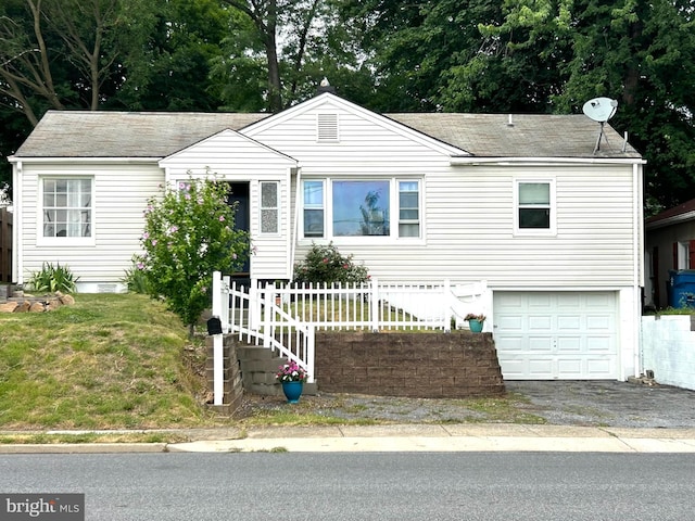 view of front of property featuring a garage