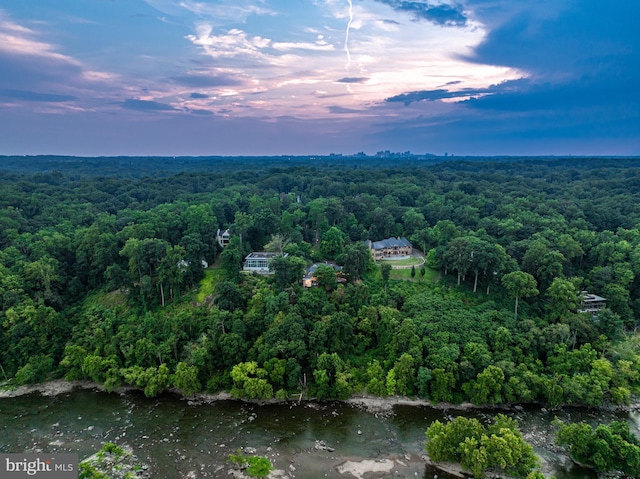 aerial view at dusk with a water view