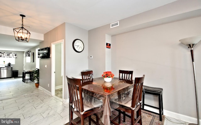 dining area with a chandelier