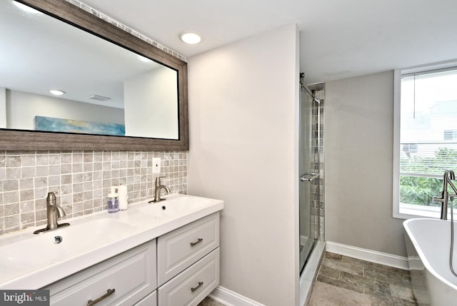 bathroom with decorative backsplash, shower with separate bathtub, and vanity