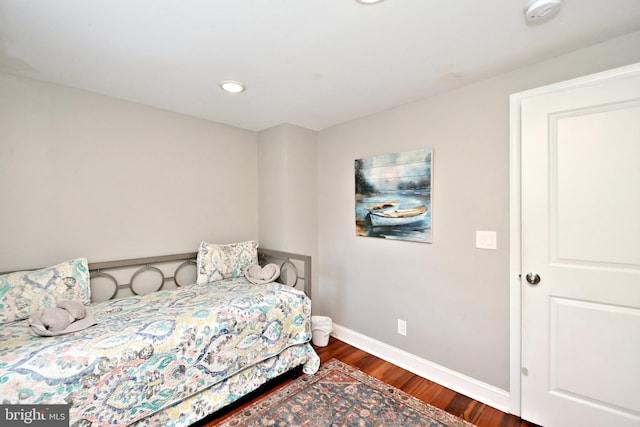 bedroom featuring dark wood-type flooring